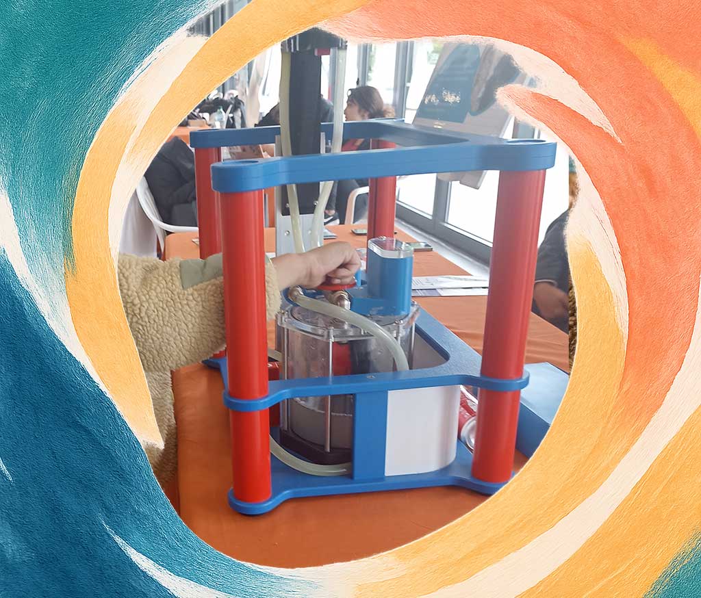 A kid playing with some science experiment set supervised by trainers