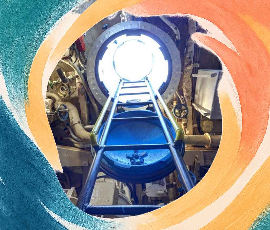 Crew hatch and steep ladder in a Romeo-class submarine museum.